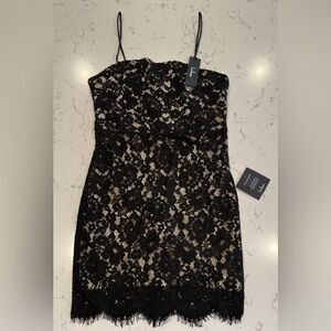 New with tags lace LBD with some light boning and spaghetti straps. Size medium